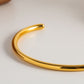 Elegante en verfijnde open goud armband
