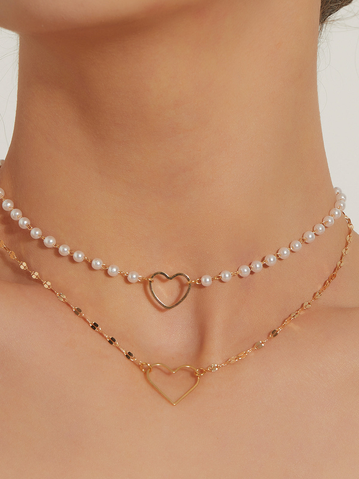 Dubbel laag oorbellen met hart en parels - Elegante en verfijnde ketting