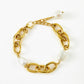 Elegante gouden armband met schakelketting en ovale parels