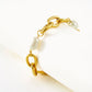 Elegante gouden armband met schakelketting en ovale parels