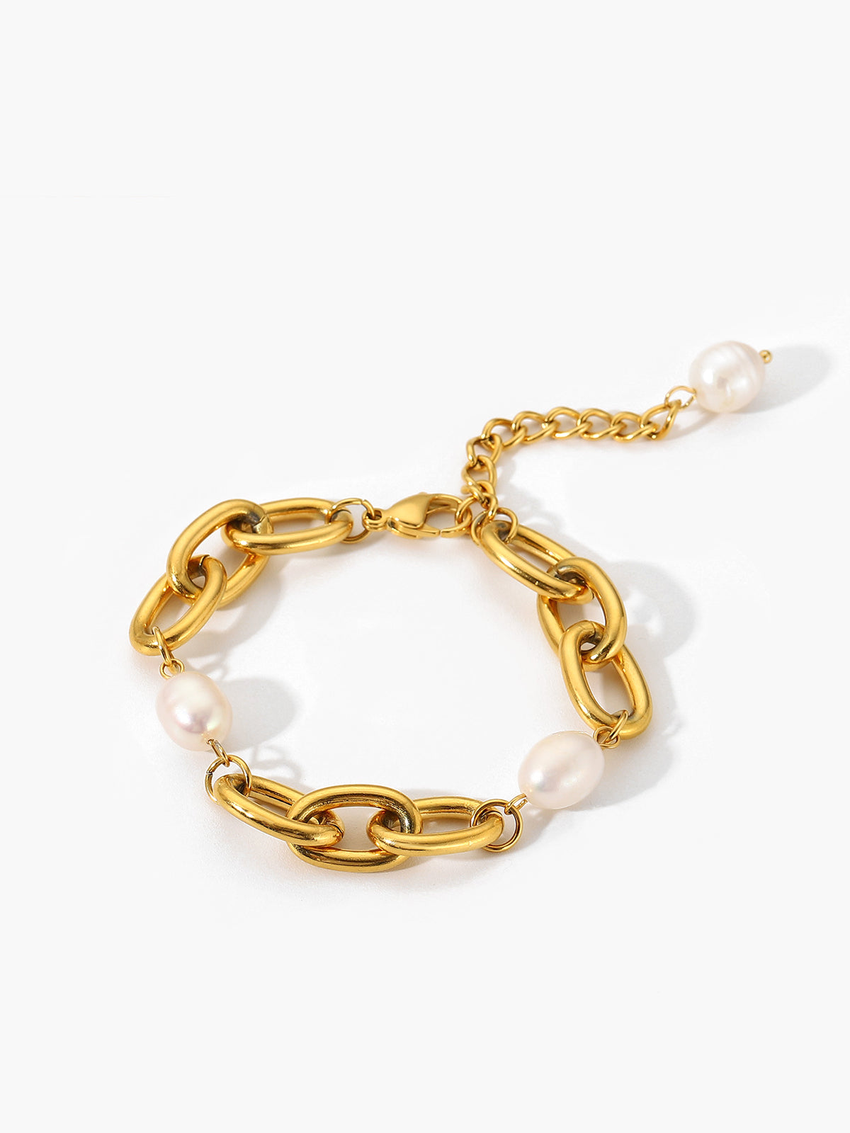 Elegante gouden armband met schakelketting en ovale parels