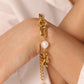 Elegante gouden armband met schakelketting en ovale parels