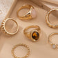 Set van 6 ringen met een mix van edelstenen en elegante texturen