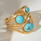 Gouden en zilveren ring met turquoise-inleg voor een elegante en verfijnde uitstraling
